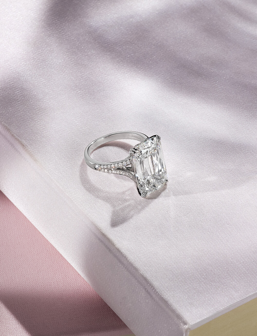 Boodles Ashoka cut diamond ring with brilliant cut diamond set split shoulders in platinum.