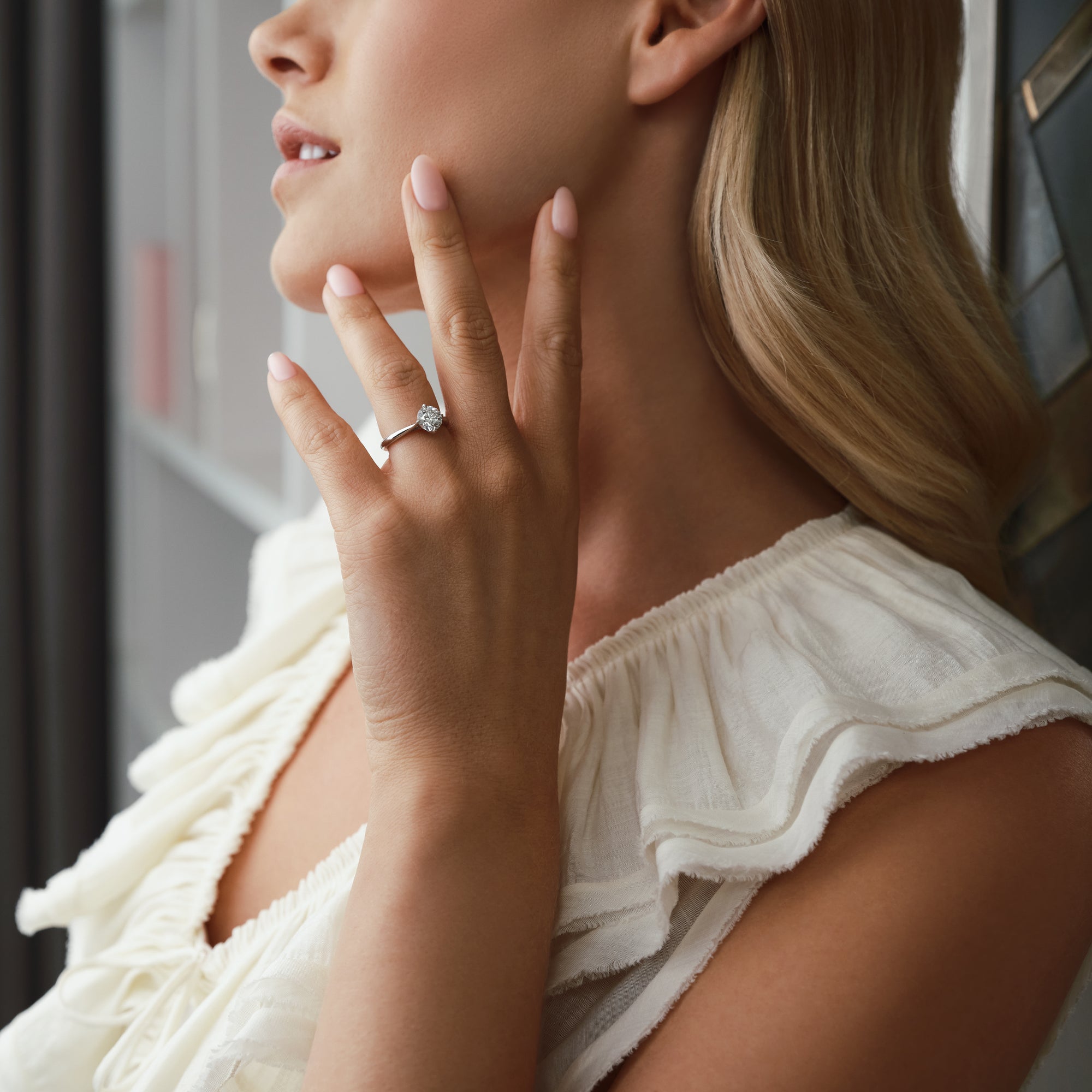 Boodles Brilliance platinum 1.5 carat diamond engagement ring worn by a woman.