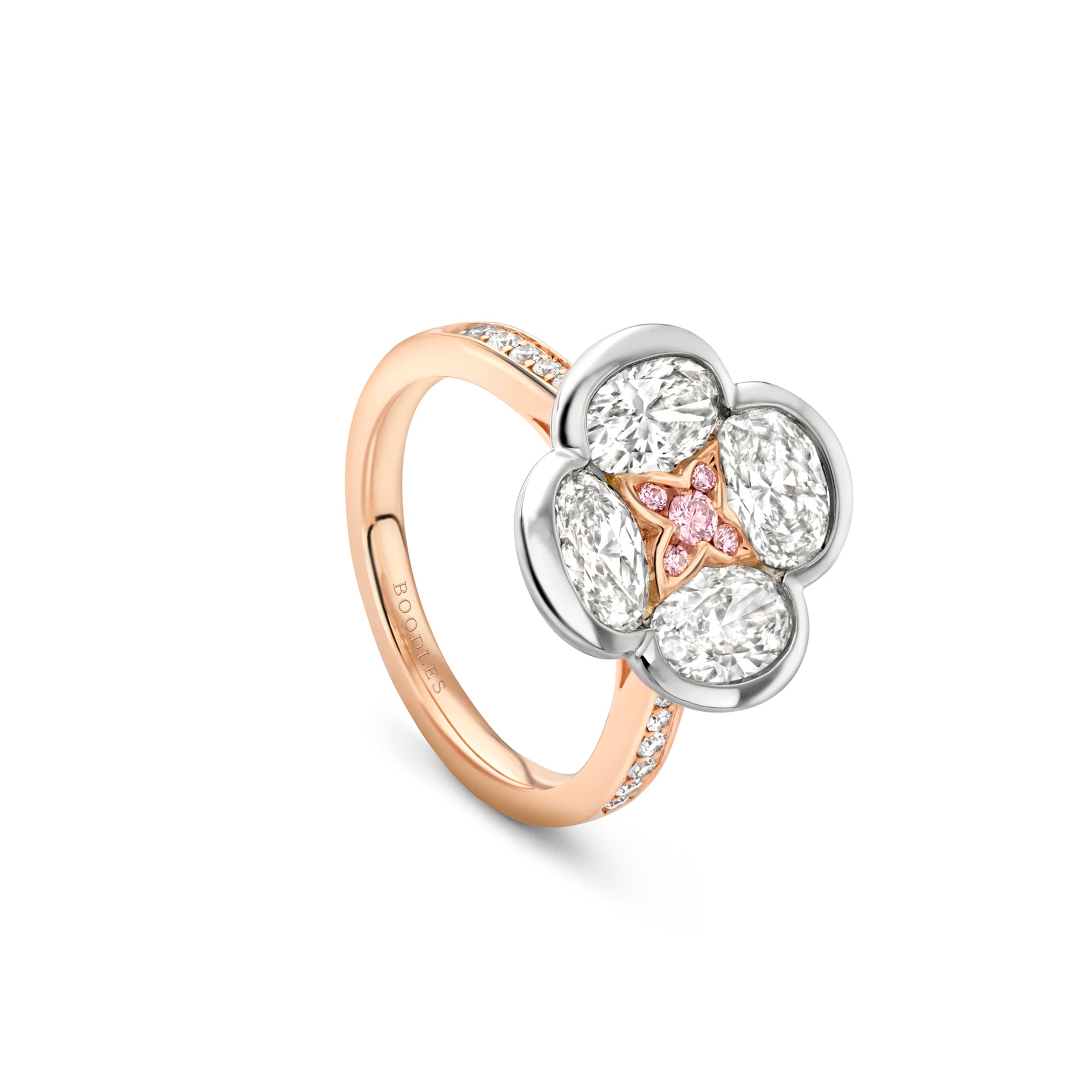 Boodles Posie ring in rose gold featuring a diamond flower cluster with a pink diamond centre.