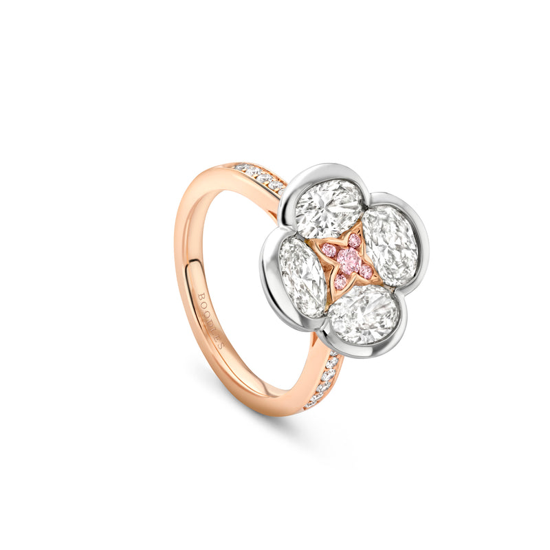 Boodles Posie ring in rose gold featuring a diamond flower cluster with a pink diamond centre.