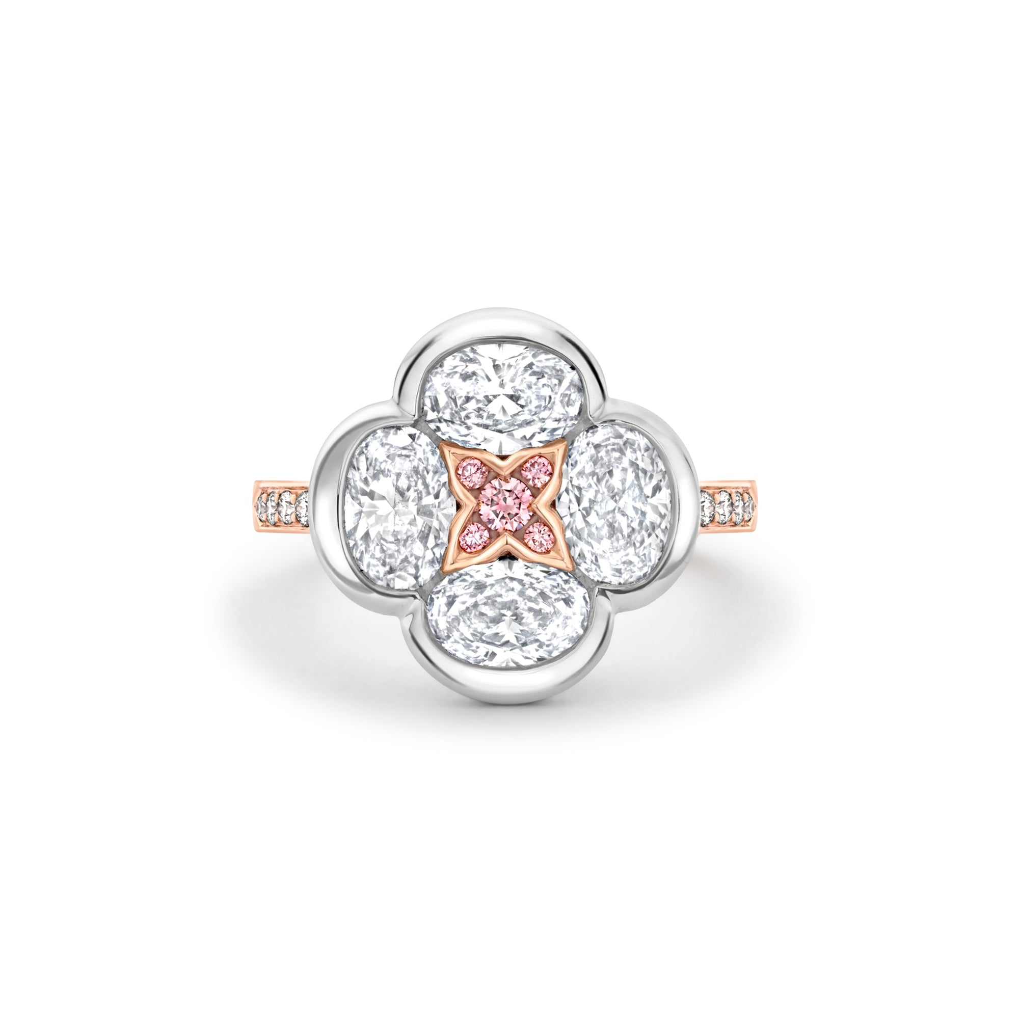 Boodles Posie ring featuring four oval white diamonds and a central rose gold motif set with pink diamonds.