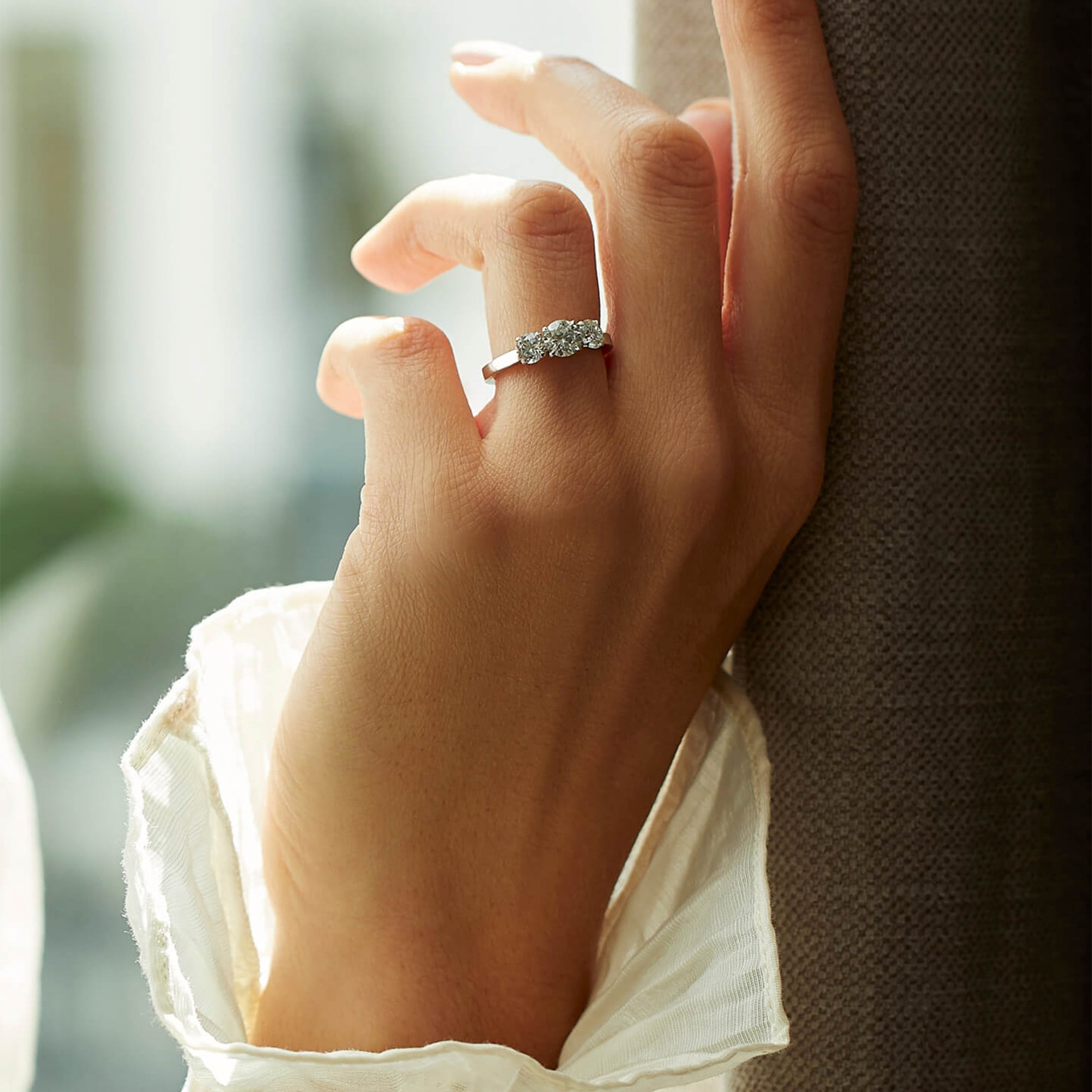 Trilogy Round Brilliant Yellow Gold Diamond Engagement Ring