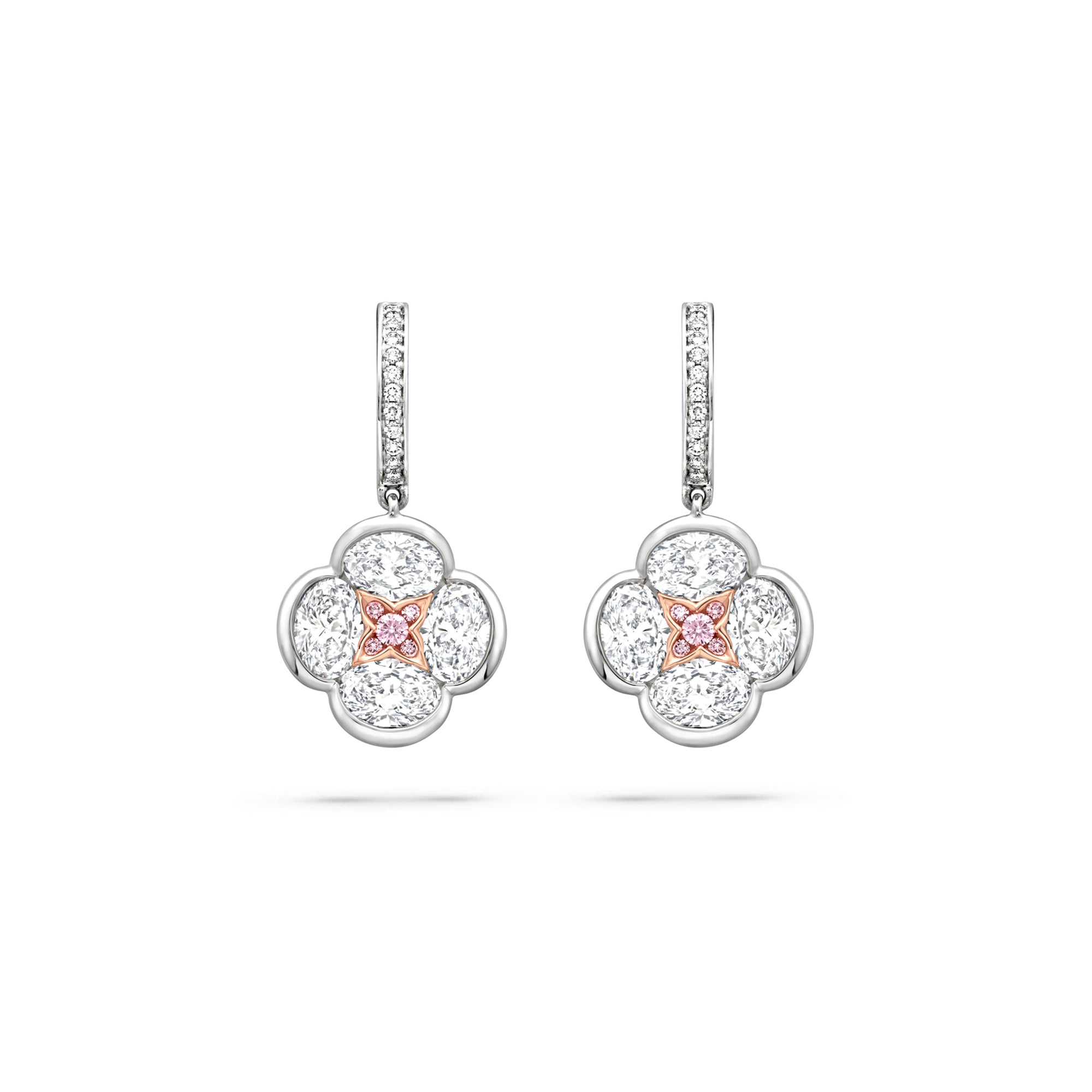 Posie diamond drop earrings featuring a four-petal white diamond design with a rose gold and pink diamond centre.