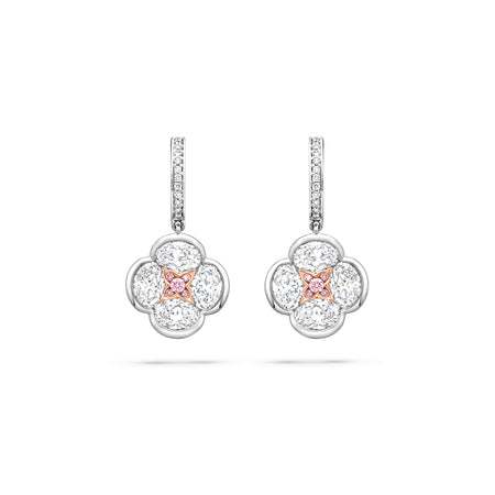 Posie diamond drop earrings featuring a four-petal white diamond design with a rose gold and pink diamond centre.