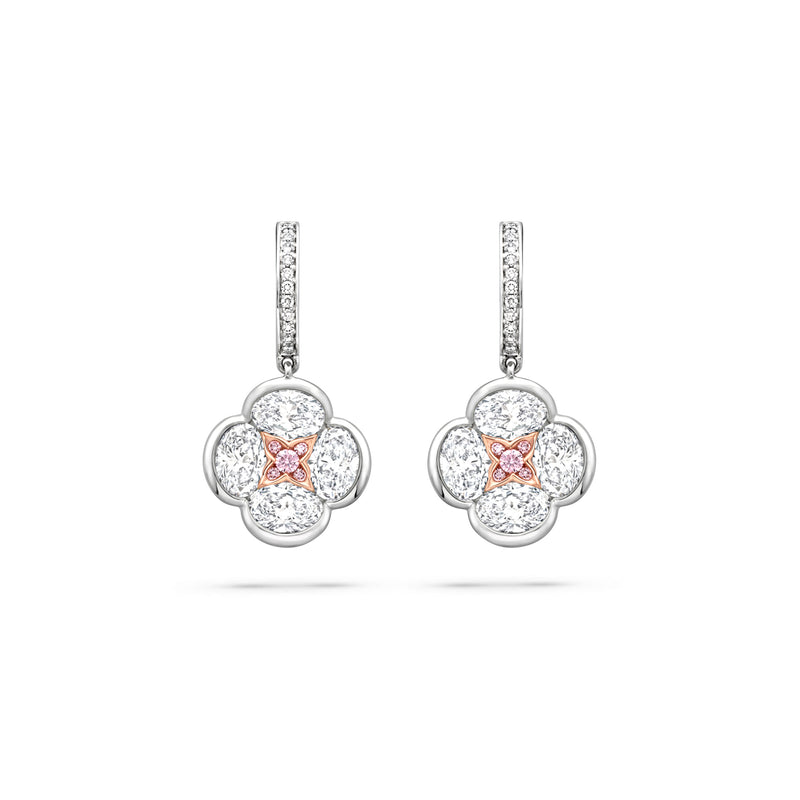 Posie diamond drop earrings featuring a four-petal white diamond design with a rose gold and pink diamond centre.