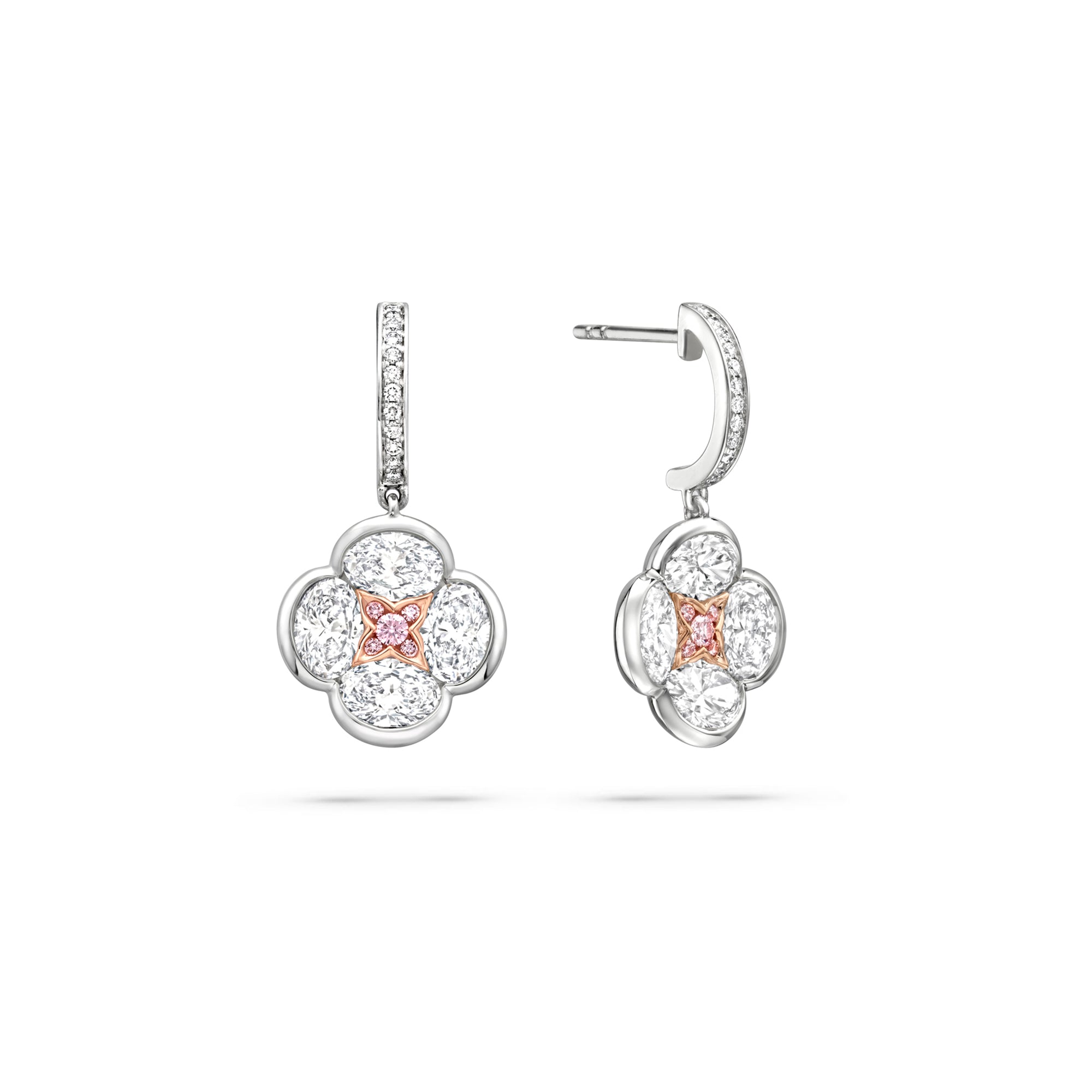 Posie diamond drop earrings featuring a four-petal flower motif with a rose gold and pink diamond centre.