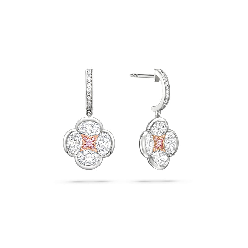 Posie diamond drop earrings featuring a four-petal flower motif with a rose gold and pink diamond centre.