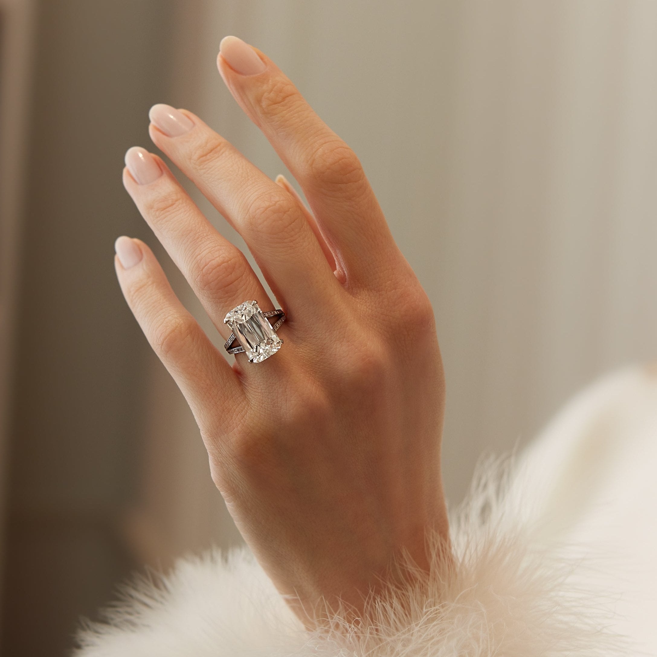 Boodles Ashoka cut diamond ring with brilliant cut diamond set split shoulders in platinum.