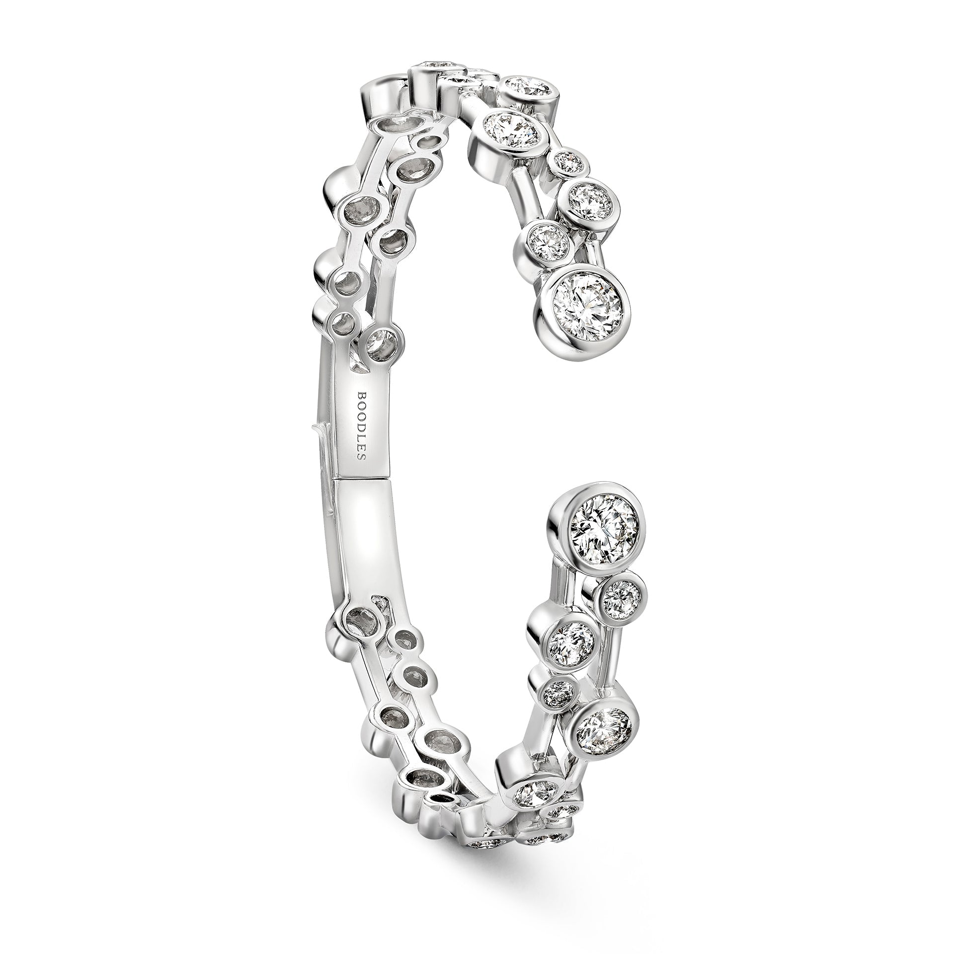 Raindance platinum bangle featuring scattered brilliant-cut diamonds in a modern open design.