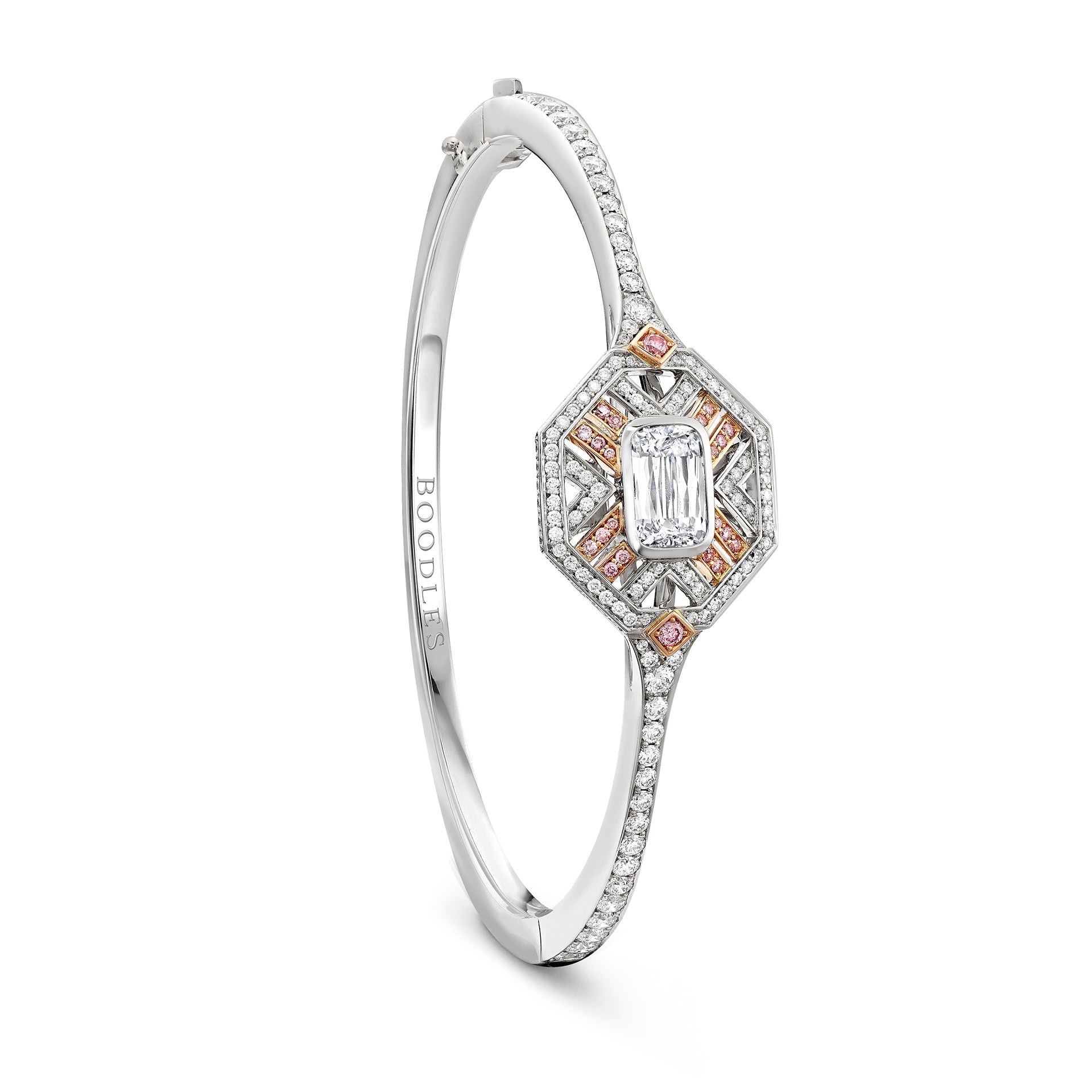 Fifth Avenue platinum bangle with central Ashoka cut diamond, pink diamonds, and white diamonds on a white background.
