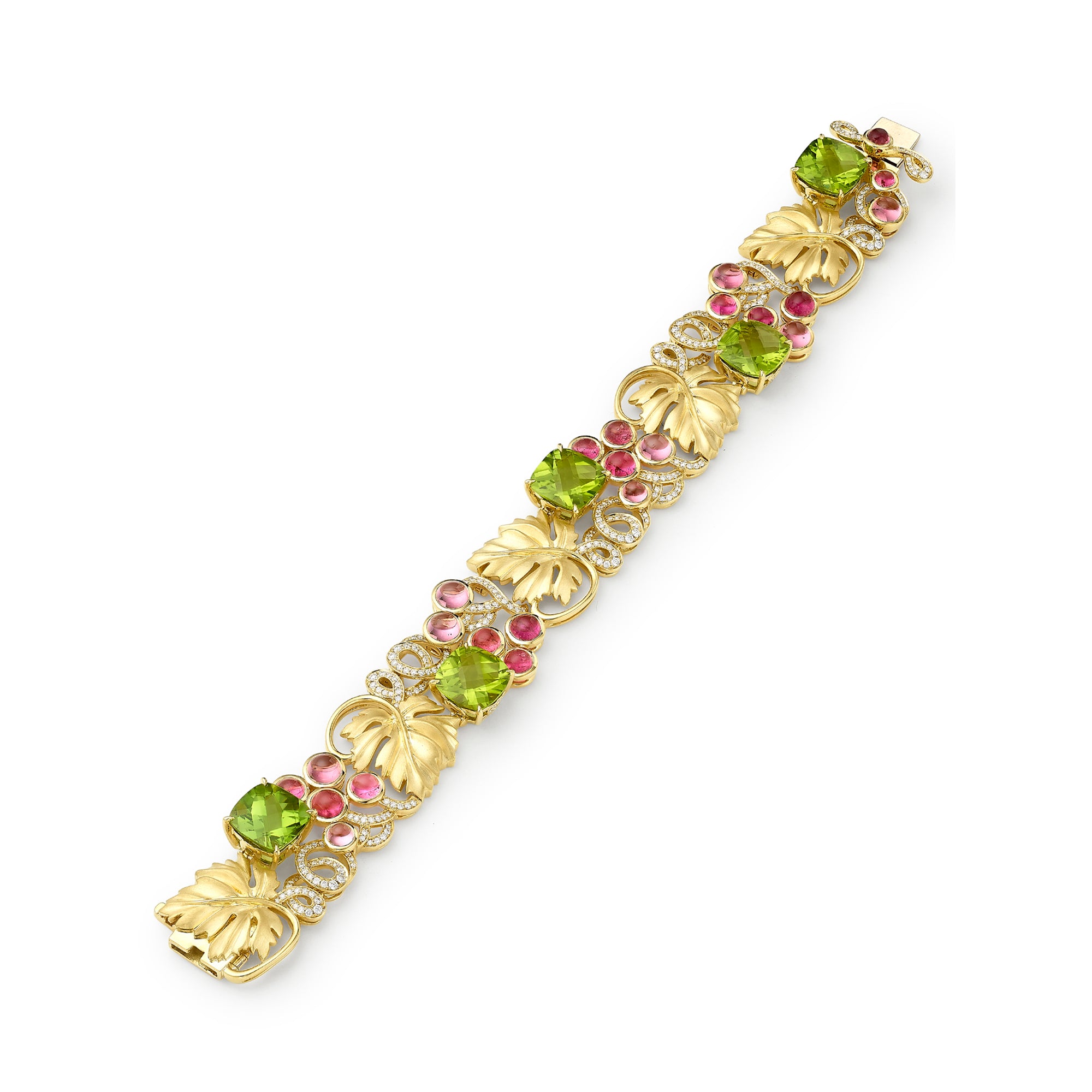 Gold bracelet with green and pink gemstones on a white background