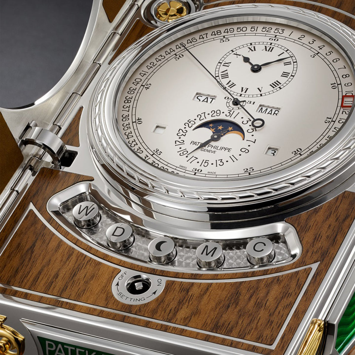 Patek Philippe Grand Complications desk clock dial with a silvery opaline face and silver cabinet details.