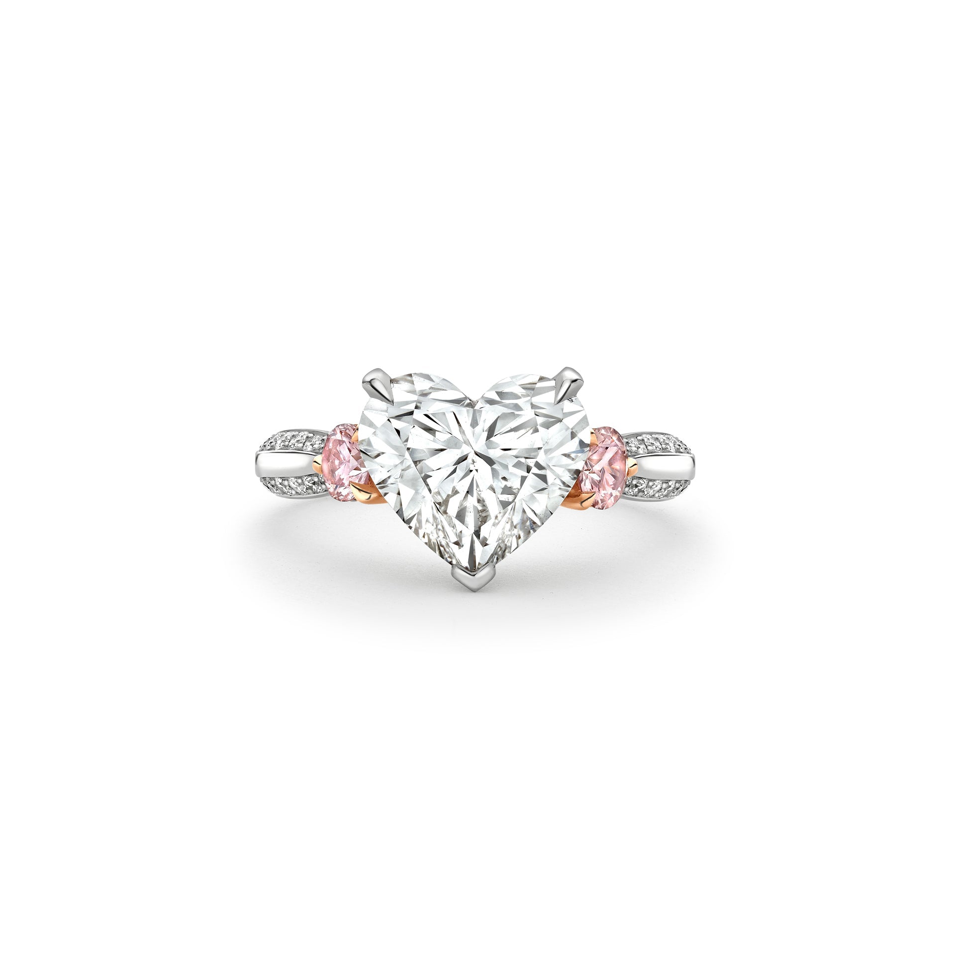 Boodles Petal platinum ring featuring a central heart-cut diamond and pink diamond side stones.