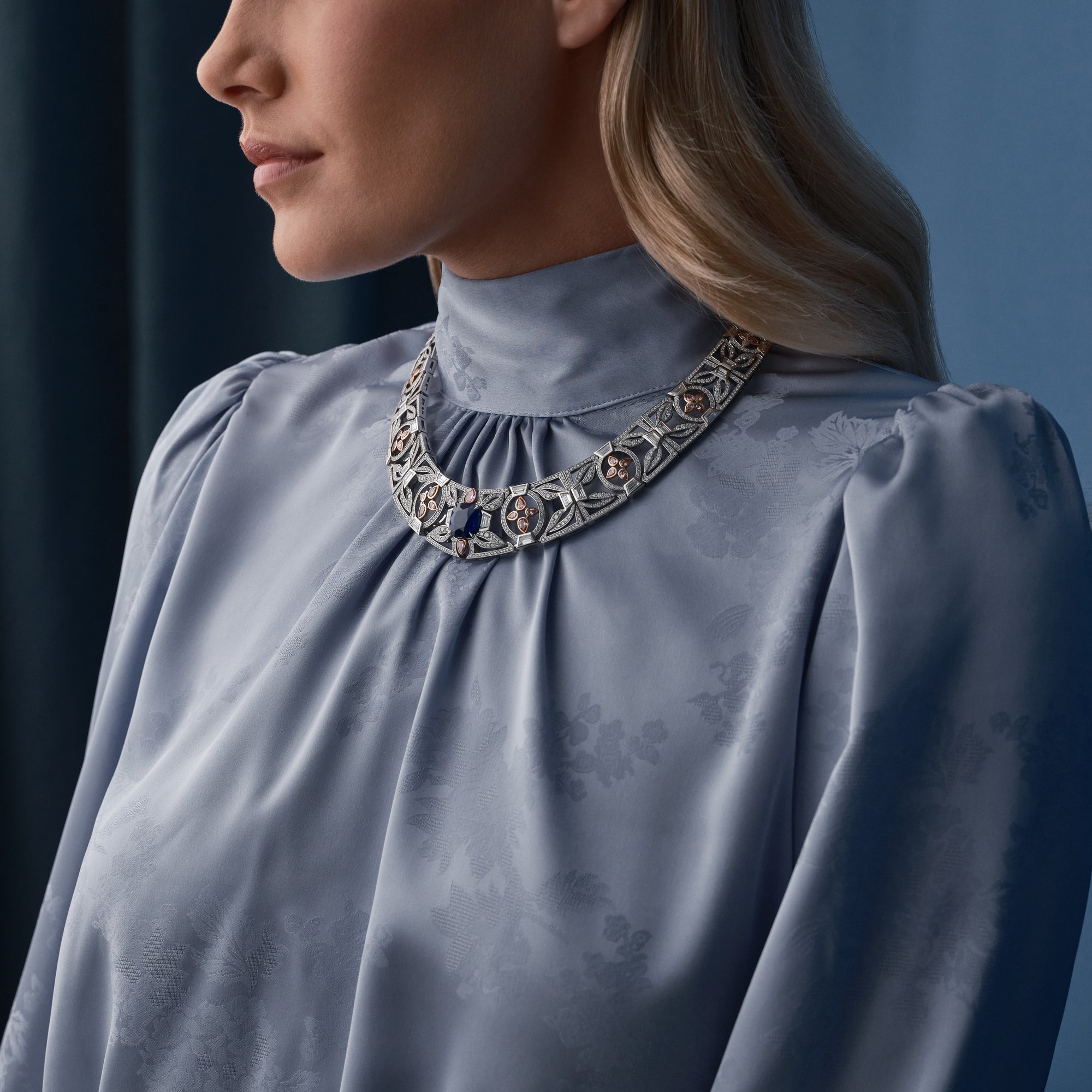 The Palace Collection Royal Porcelain sapphire and diamond collar in platinum and rose gold, worn by a woman.