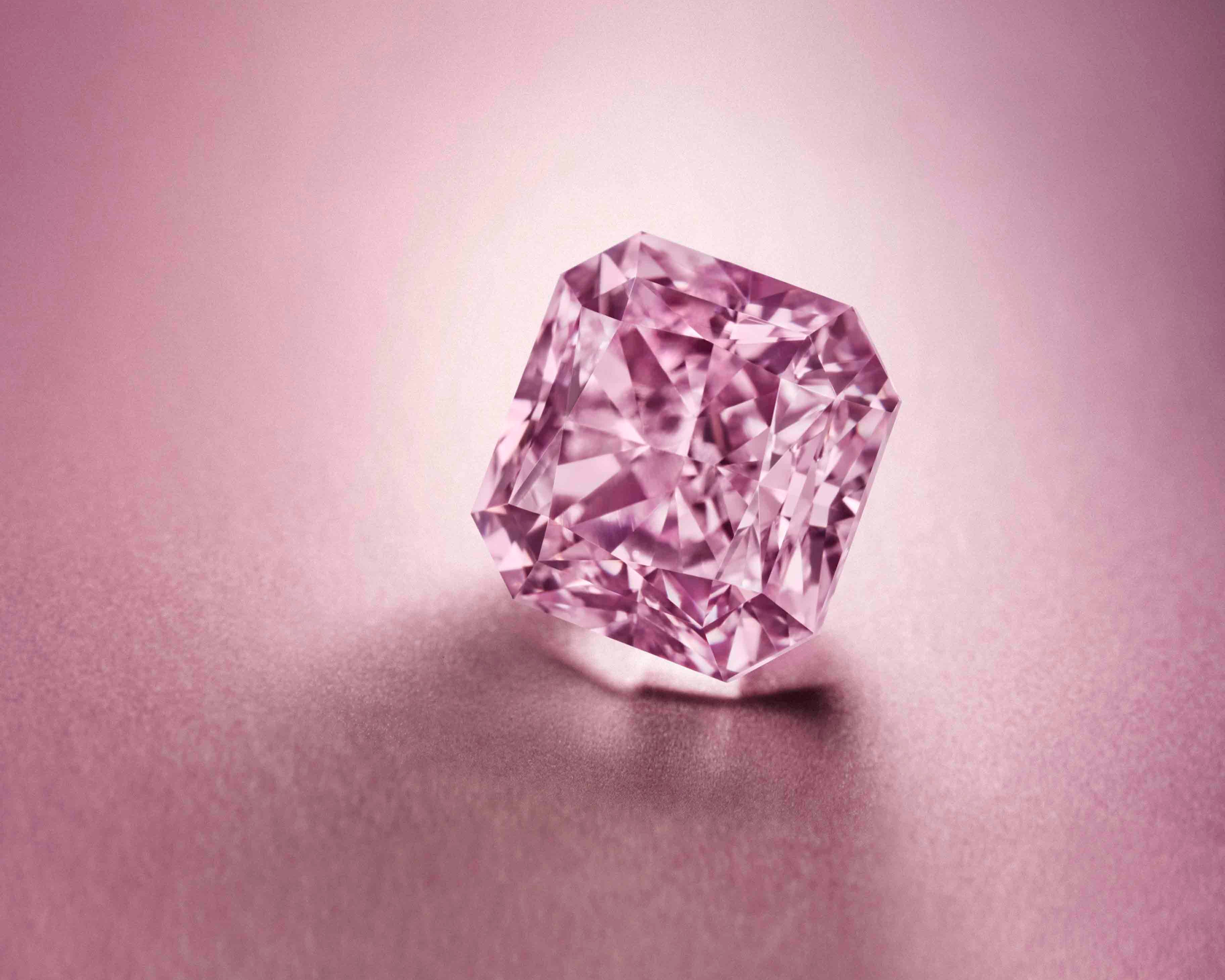 Argyle Pink cushion cut diamond on a pink background