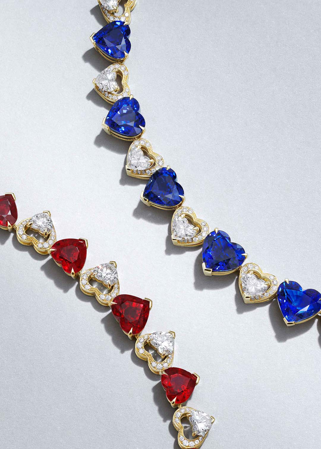Classic solid gold necklace with heart shaped sapphires and rubies and white diamonds. High jewellery elegant and classic design.