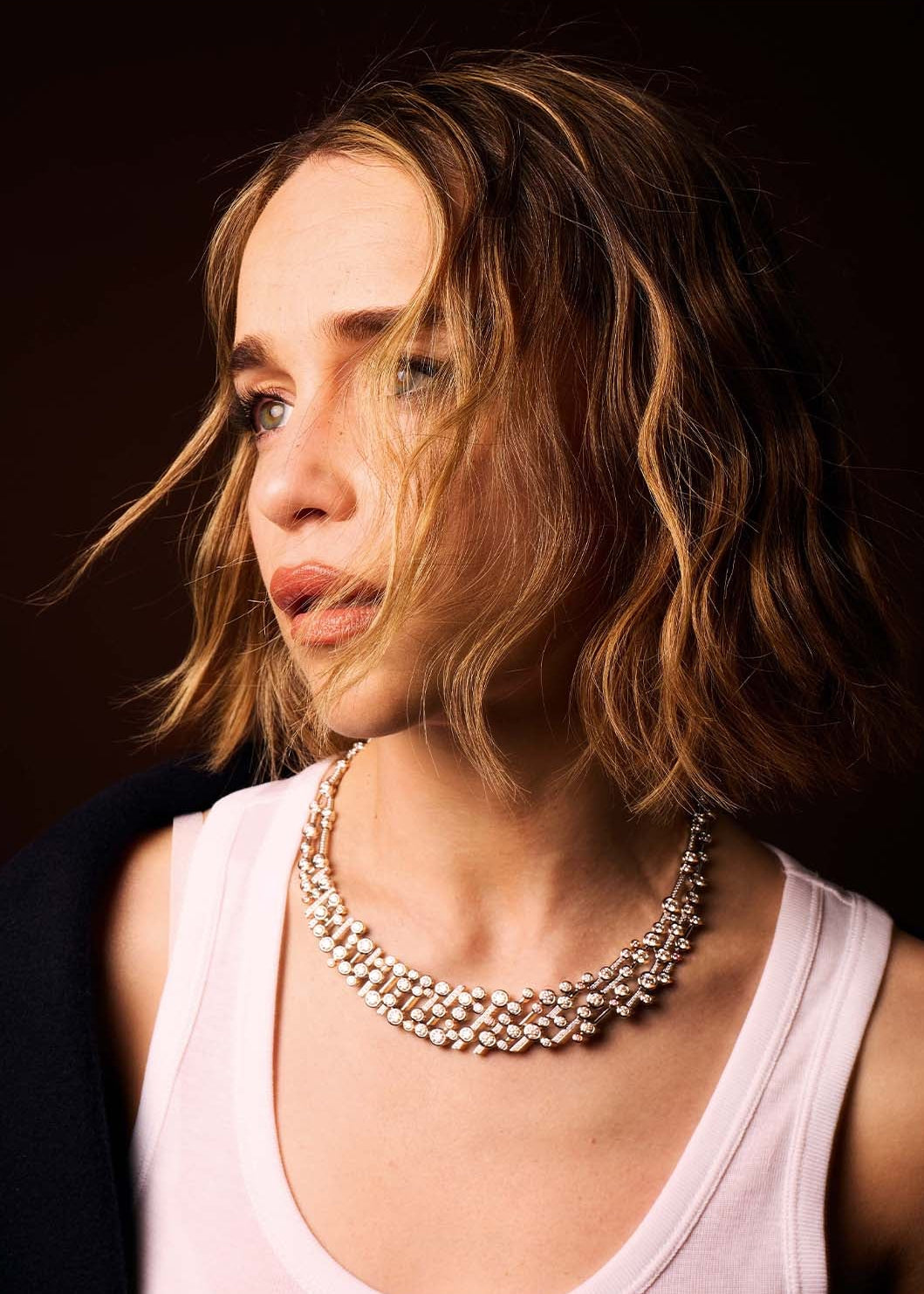 Emilia Clarke showcasing the iconic Boodles Raindance diamond jewellery necklace in platinum, featuring multi-strand brilliant-cut pink diamonds.