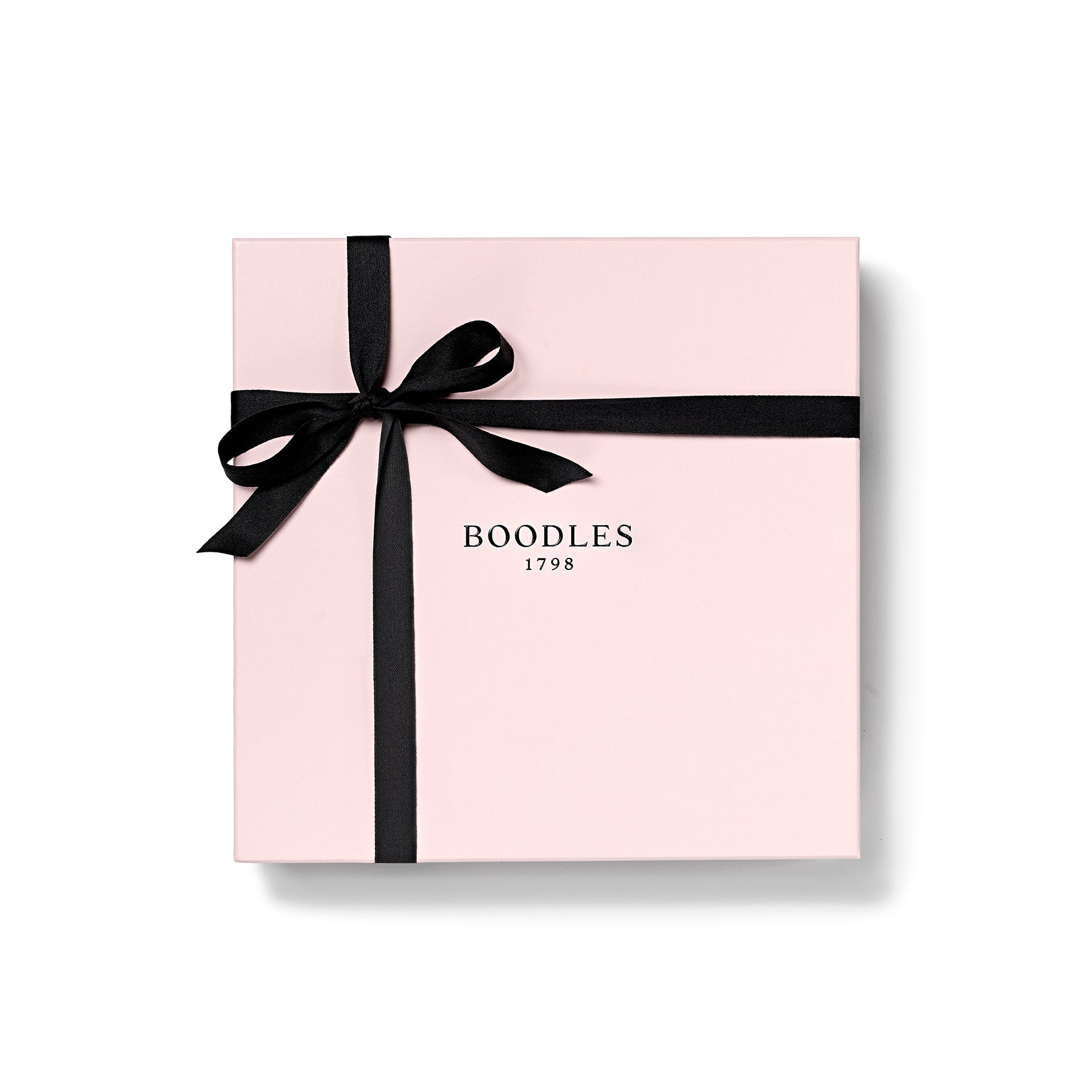 A pink box with the Boodles brand logo, tied with a black ribbon.