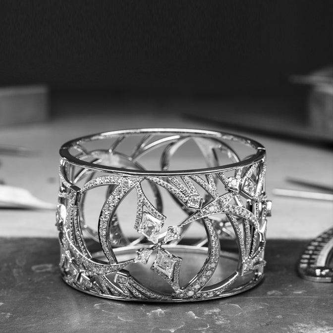A platinum bangle with natural diamonds, vintage style inspired by the Royal Ballet. A luxury jewellery bracelet from the Pas de deux collection by Boodles.