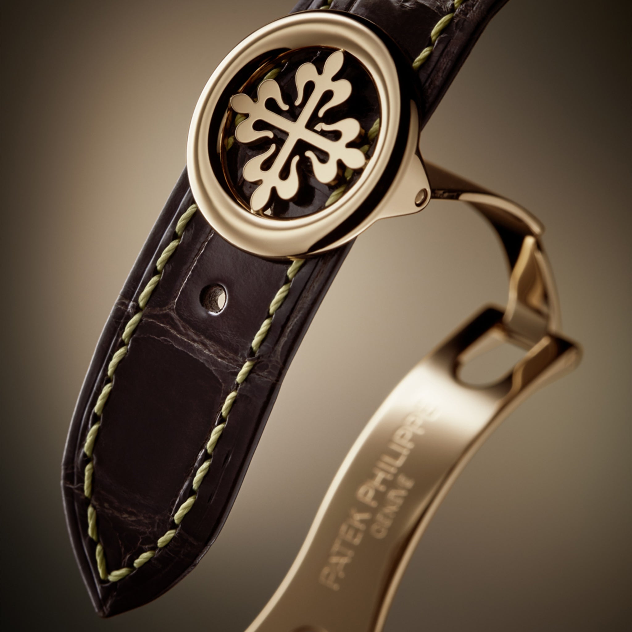 Rose gold fold-over clasp on a dark chestnut alligator leather strap for Patek Philippe Ref. 5396R-016.