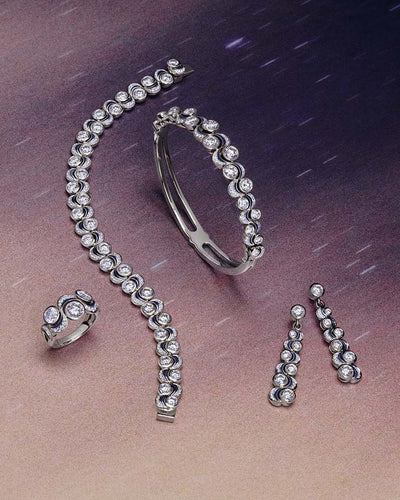 An Over the Moon design jewellery collection set with brilliant cut diamonds and midnight blue enamel in platinum by Boodles. enchanting, modern, magical.