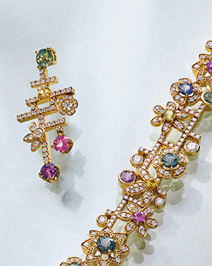 Secret Garden design bracelet and earrings set with brilliant cut multi-coloured sapphires and diamonds in 18 carat yellow gold. 