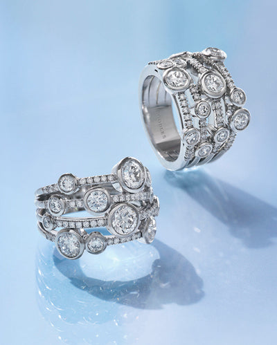 Two Waterfall rings set with diamonds in platinum. The total weight of the main diamonds are 1.40 carats. The total weight of the additional diamonds is approximately 0.25 carats.